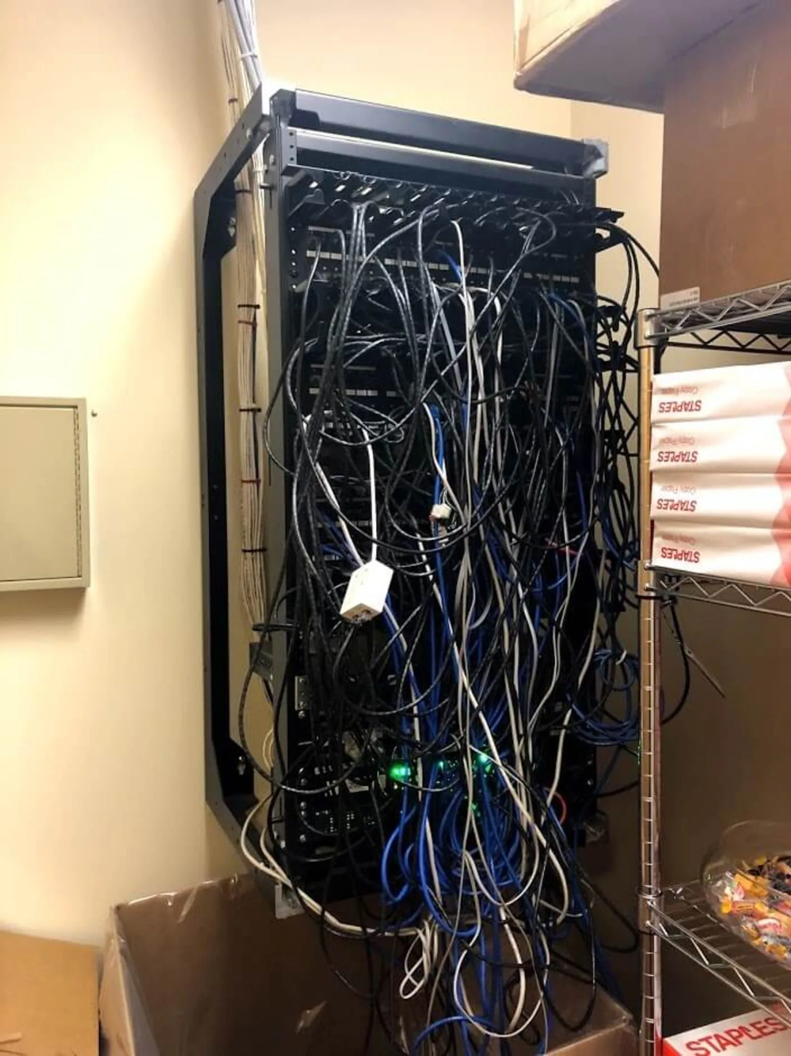 Hanging rack before cleanup — messy cables