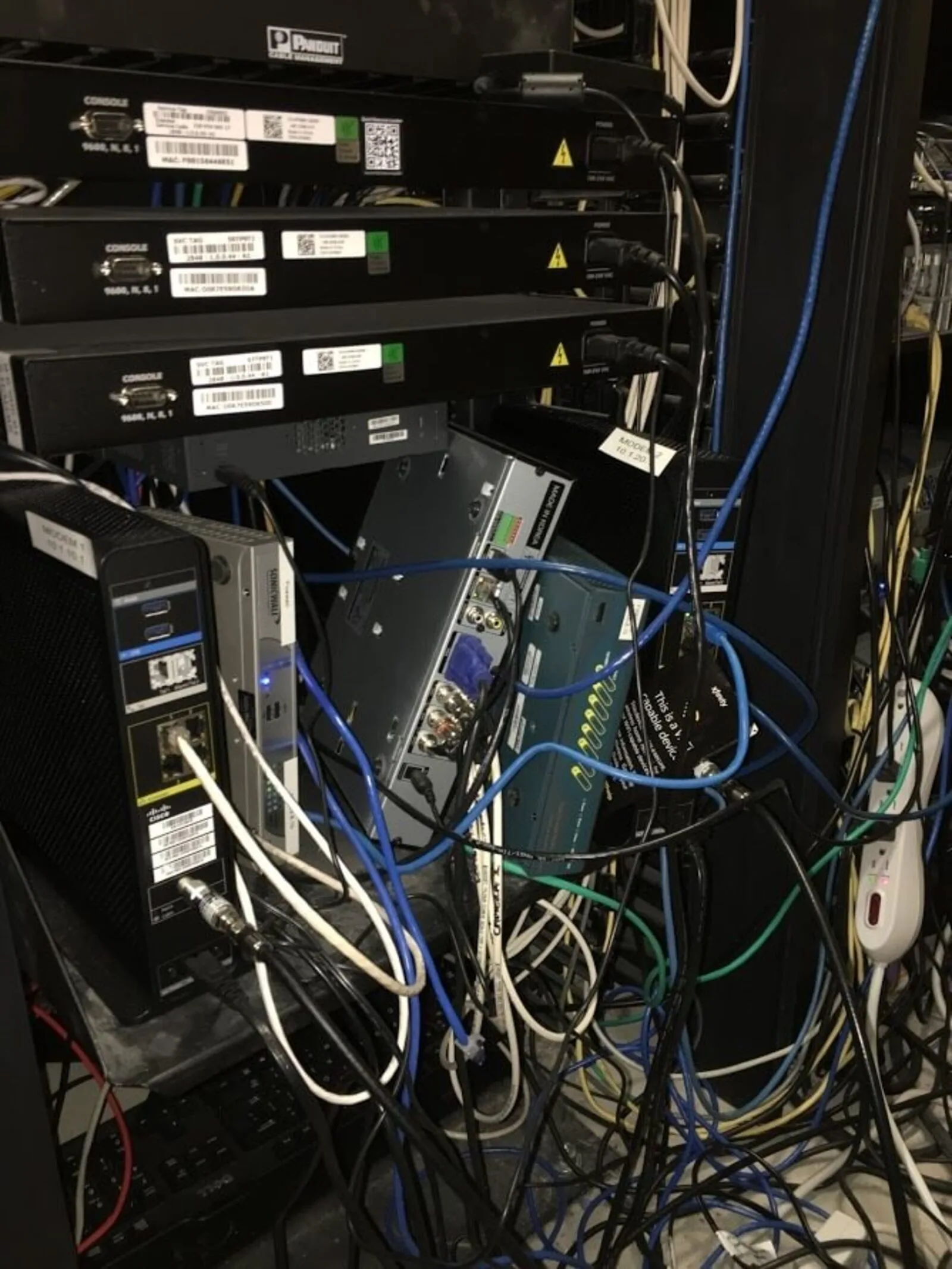 Loose items before — boxes and cables on the floor